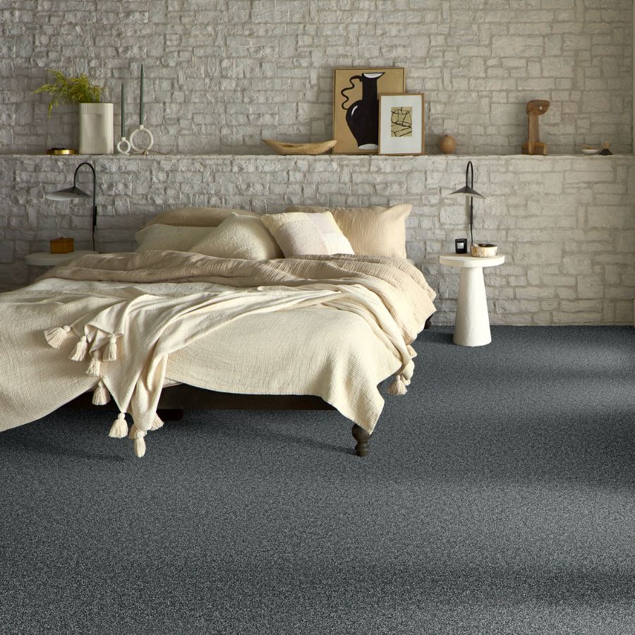 grey carpets in a stylish bedroom with white brick accent wall in North Florida